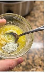 Chicken, corn, and potatoes cooking in the crockpot