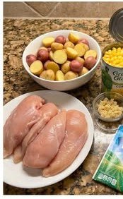 Ingredients for crockpot garlic butter chicken with ranch corn and baby potatoes