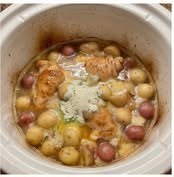 Chicken, potatoes, and ranch seasoning in a crockpot