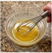 Honey butter ranch sauce being whisked in a bowl
